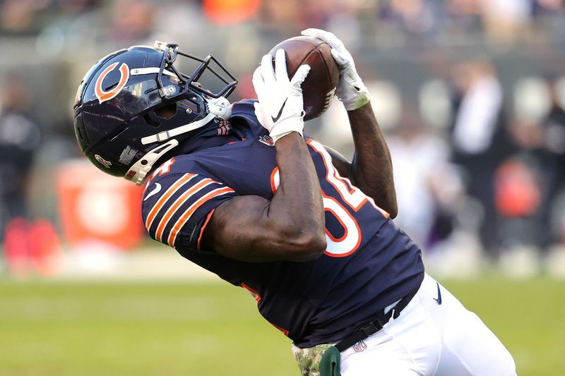 Bears prijímač Marquise Goodwin ťahá v nedeľu pristátie.