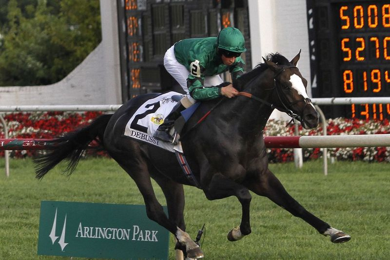 Jockeyen William T. Buick rider Debussy til sejr i det 28. løb af Arlington Million-hestevæddeløbet på Arlington Park Race Track i Arlington Heights i 2010.
