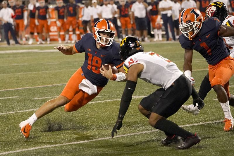 Illinoisi tagamängija Brandon Peters teeb lõike, kui Marylandi kaitsemängija Nick Cross astub 17. septembri mängu ajal ette.