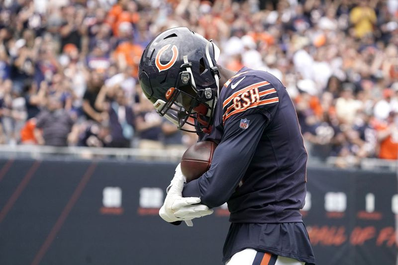 Rodney Adams rockt het voetbal als een baby na zijn touchdown-vangst zaterdag.