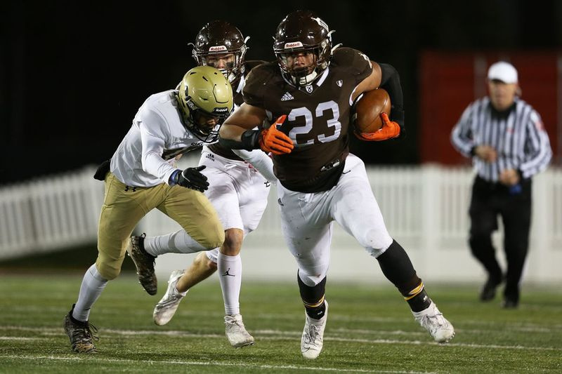 Joliet Catholics Jordan Anderson (23) bærer bolden.