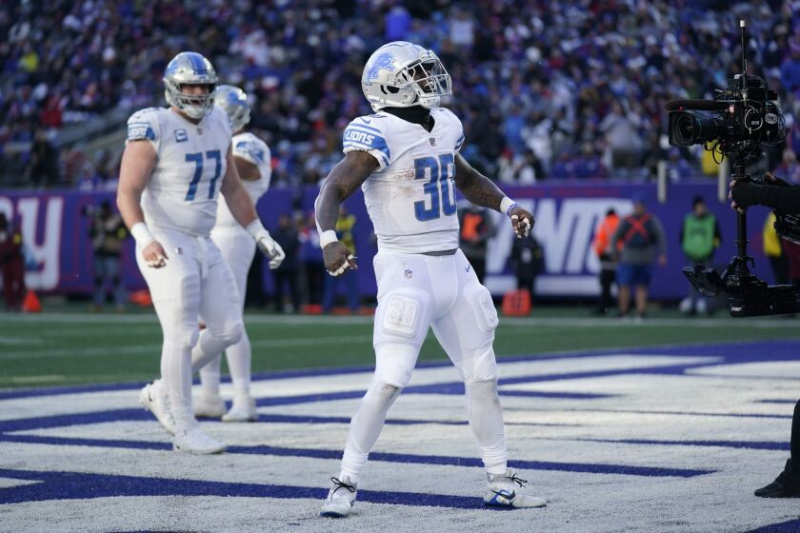  Lions rennen terug Jamaal Williams (30) reageert na het scoren van een touchdown tijdens de tweede helft van de wedstrijd van zondag tegen de Giants.